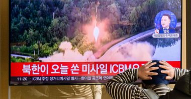A man reacts to television reports on news broadcast with file footage of a North Korean missile test, Seoul, South Korea, Nov. 18, 2022. (AFP Photo)