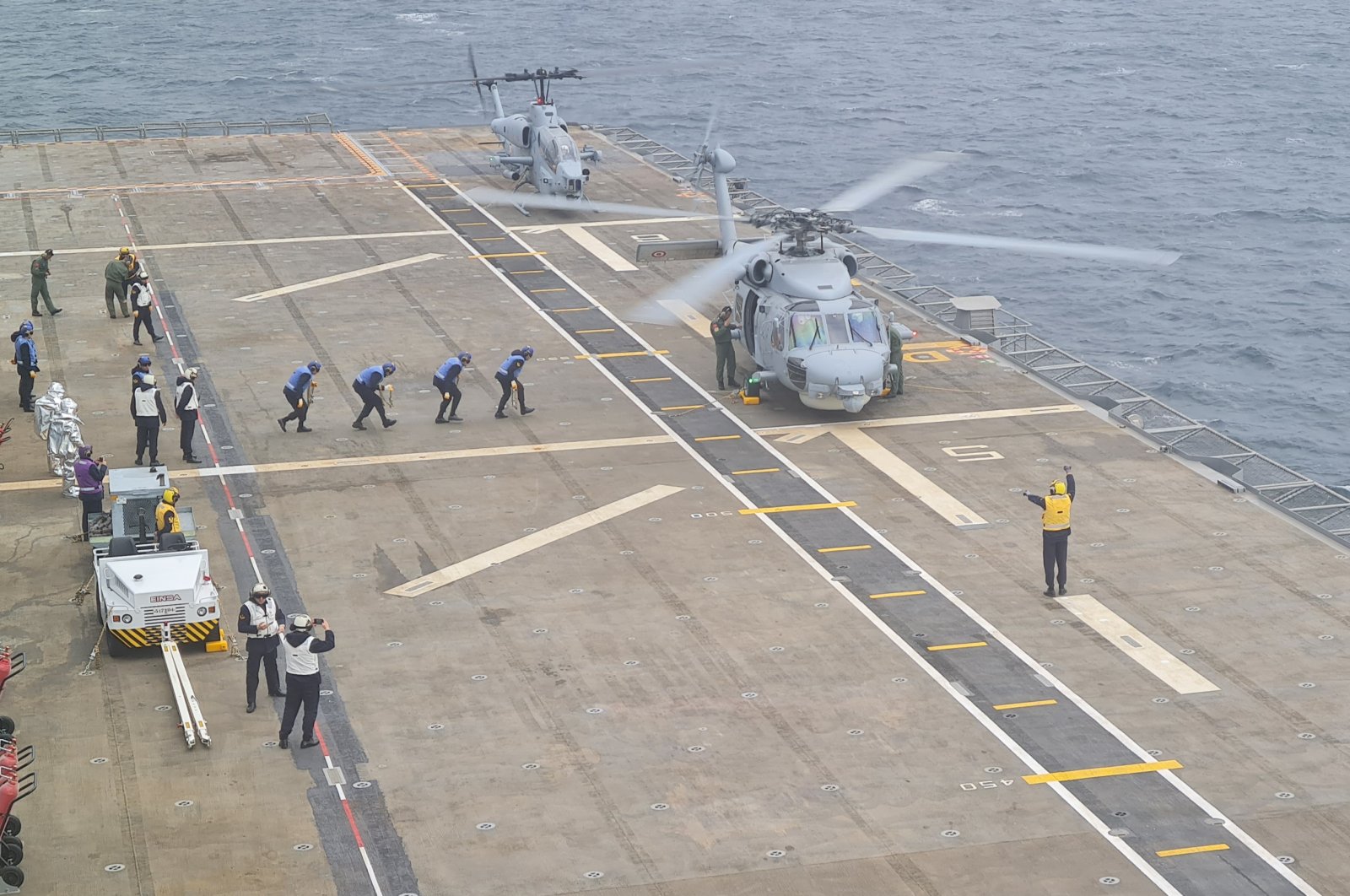 Two helicopters are seen during the deployment on Anadolu LHD, Istanbul, Türkiye, Nov. 18, 2022. (Photo: @tcsavunma)