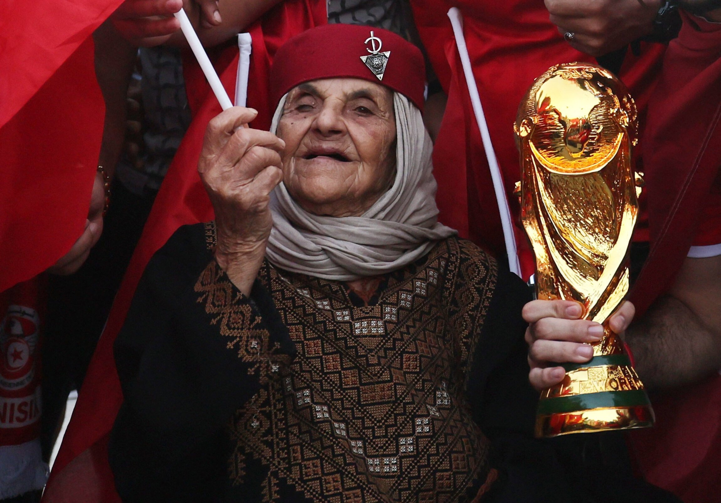 qatar-fans-cheer-for-the-2022-world-cup-hand-flag-waving-various-small