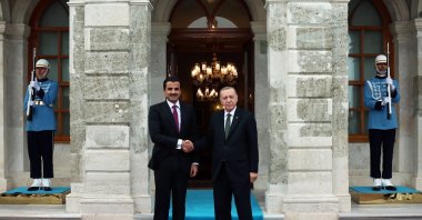 President Recep Tayyip Erdoğan (R) shakes hands with the emir of Qatar, Sheikh Tamim bin Hamad Al Thani, in Istanbul, Türkiye, Oct. 14, 2022. (Turkish Presidency handout via EPA)