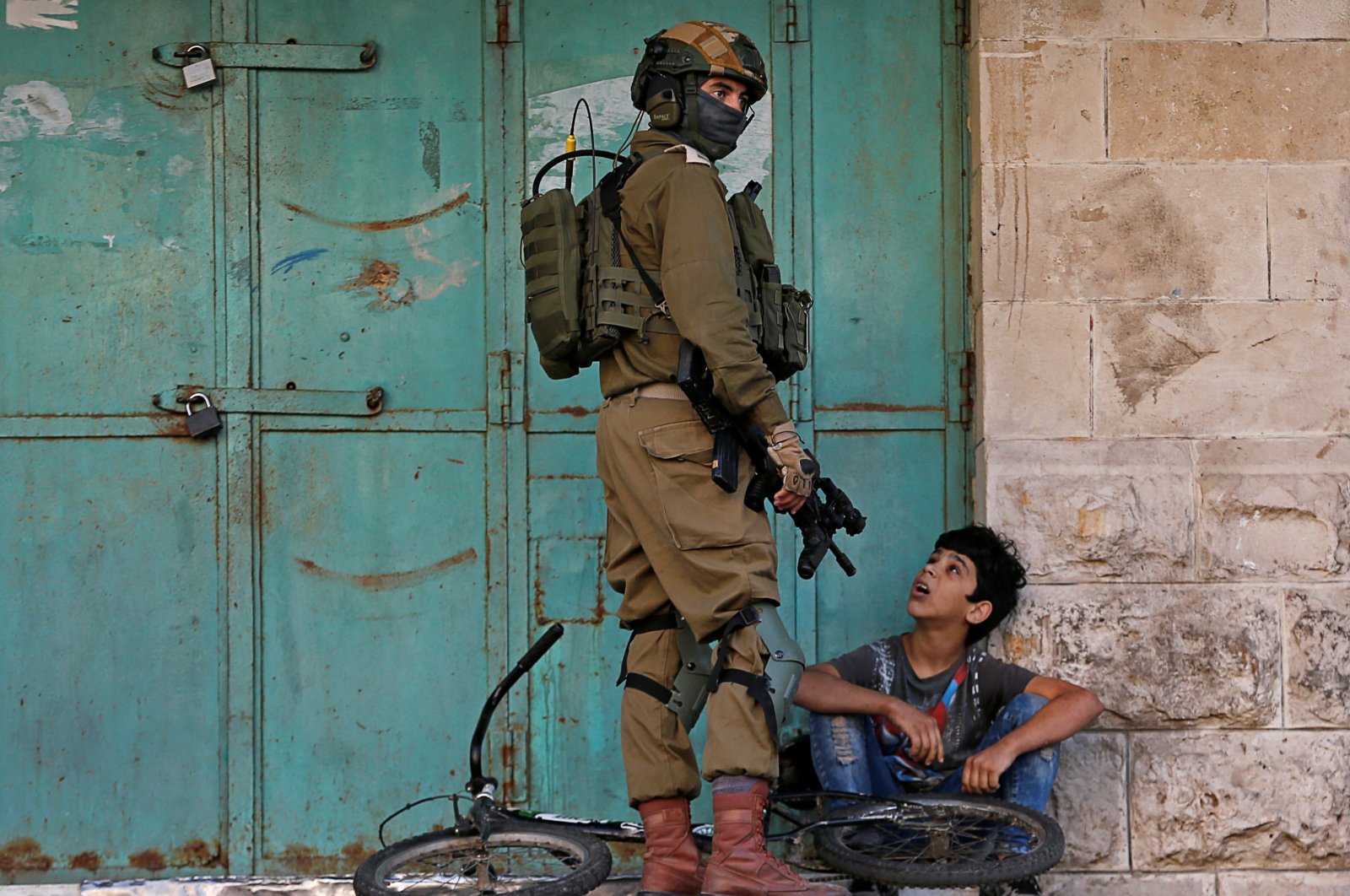 An Israeli soldier detains a Palestinian boy during an anti-Israel protest in Hebron in the Israeli-occupied West Bank, Palestine, Nov. 29, 2019. (Reuters File Photo)