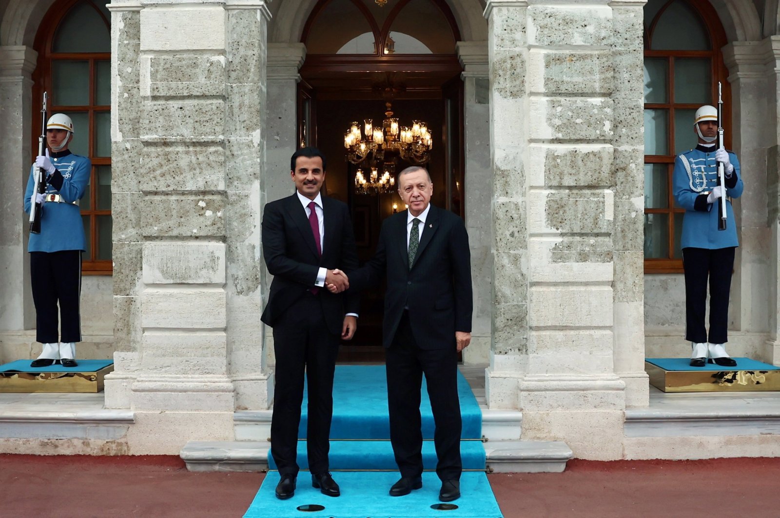 President Recep Tayyip Erdoğan (R) shakes hands with the emir of Qatar, Sheikh Tamim bin Hamad Al Thani, in Istanbul, Türkiye, Oct. 14, 2022. (Turkish Presidency handout via EPA)