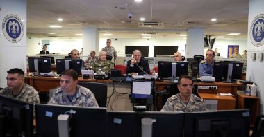A handout photo made available by the Turkish Defense Ministry shows Turkish Defense Minister Hulusi Akar (C) and Turkish Chief of General Staff Yaşar Güler (C-L) watching the progress of the air raid, at the Turkish Air Forces Command in Ankara, Türkiye, Nov. 20, 2022. (EPA Photo)