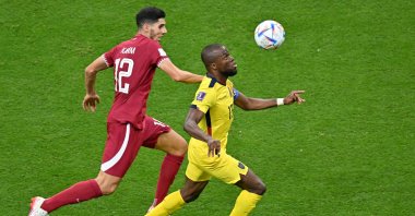 Qatar's Karim Boudiaf (L) vies with Ecuador's Enner Valencia (R) during a FIFA World Cup match, Al Khor, Qatar, Nov. 20, 2022. (AA Photo)