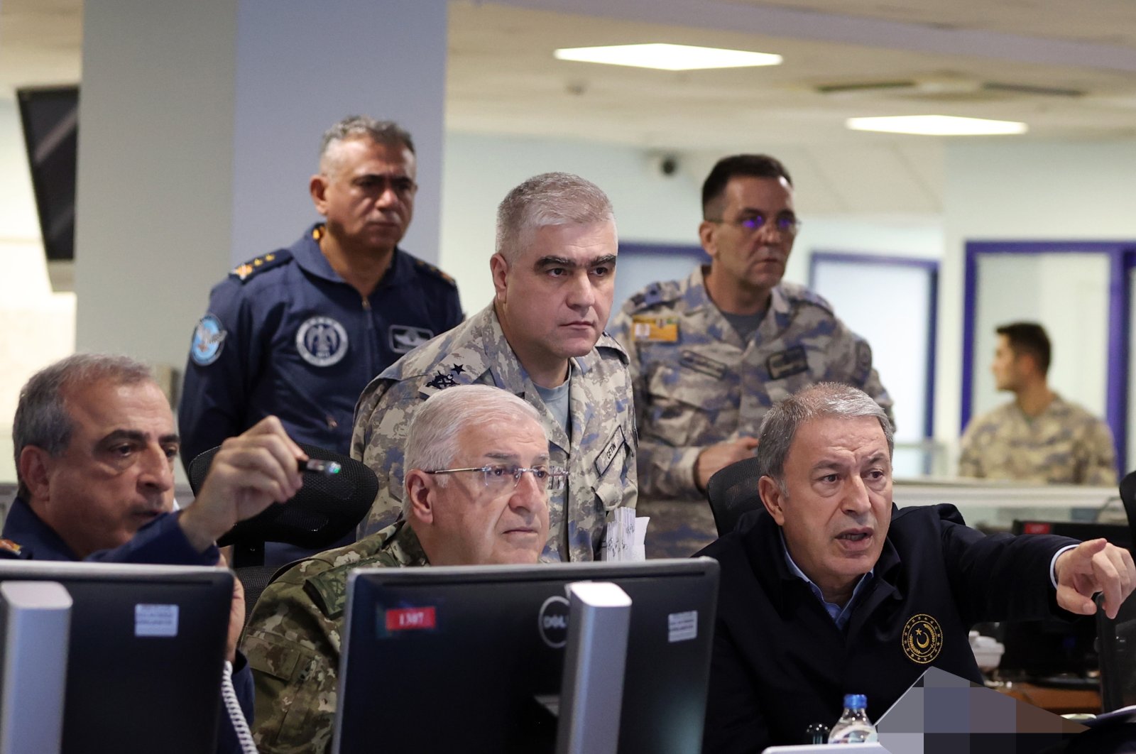 Defense Minister Hulusi Akar (R) follows the operation with military commanders at the operations center in the capital Ankara, Türkiye, Nov. 20, 2022. (AA Photo)