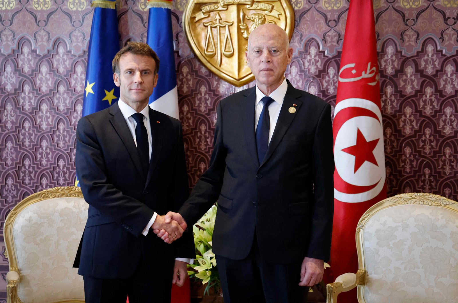 France&#039;s President Emmanuel Macron (L) and Tunisia&#039;s President Kais Saied (R) shake hands before a bilateral meeting during the 18th Francophone countries summit in Djerba, Tunisia, Nov., 19, 2022. (AFP Photo)