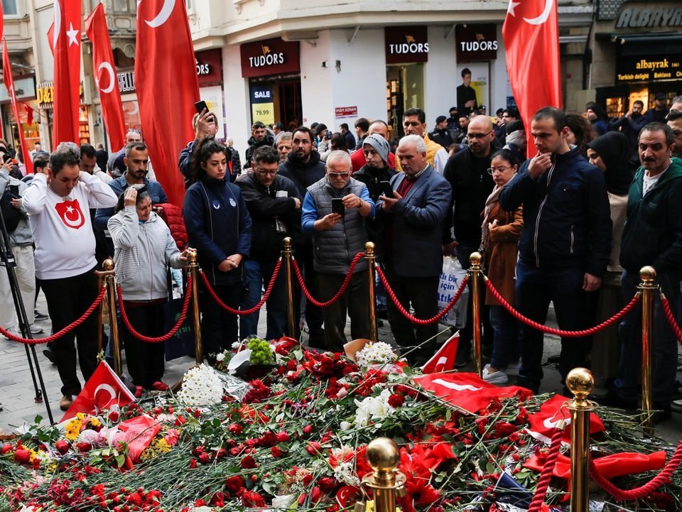 People lay flowers to pay tribute to the victims of a Sunday&#039;s blast that took place on Istiklal Street, in Istanbul, Türkiye, Nov. 15, 2022. (Reuters Photo)