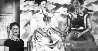 Artist Frida Kahlo with her painting entitled, &quot;Me Twice,&quot; Oct. 24, 1939. (Getty Images Photo)