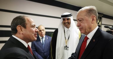 President Recep Tayyip Erdoğan shakes hands with his Egyptian counterpart Abdel-Fattah el-Sissi (L) during their meeting at the opening ceremony of the World Cup in Doha, Qatar, Nov. 20, 2022. (EPA Photo)