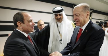 President Recep Tayyip Erdoğan shakes hands with his Egyptian counterpart Abdel-Fattah el-Sissi (L) during their meeting at the opening ceremony of the World Cup in Doha, Qatar, Nov. 20, 2022. (EPA Photo)