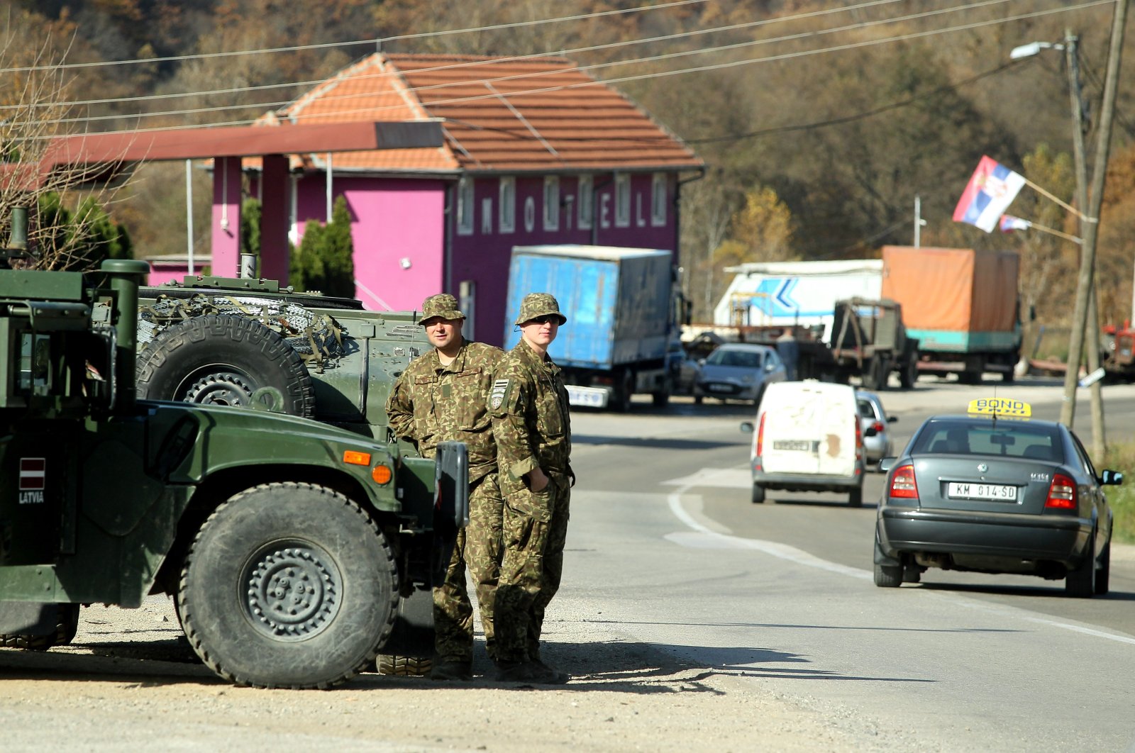 Members of the Latvian contingent of NATO-led international peacekeeping force in Kosovo (KFOR) observe the Jarinje border crossing between Kosovo and Serbia at Jarinje, Kosovo, Nov. 1, 2022. (EPA Photo)