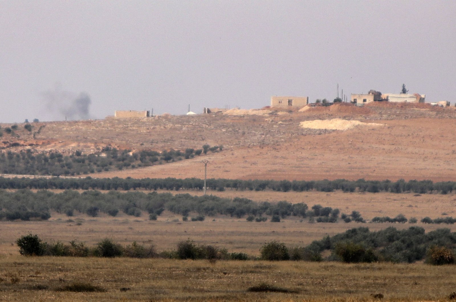 This picture taken on Nov. 21, 2022 from a position in Jarablus in the northern part of Aleppo province, controlled by Türkiye-backed Syrian opposition forces, shows smoke billowing from YPG/PKK-controlled areas. (AFP Photo)