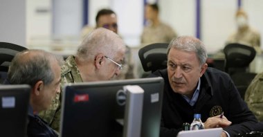 Defense Minister Hulusi Akar (R) and Chief of General Staff Yaşar Güler (L) watching the progress of the Claw-Sword air operation, at the Air Forces Command in Ankara, Türkiye, Nov. 20, 2022. (Defense Ministry Handout Photo via EPA)