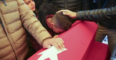 A child cries over the coffin of his 5-year-old brother killed in a rocket attack by the PKK terrorist organization in Türkiye's Gaziantep province, Nov. 22, 2022. (AA Photo)