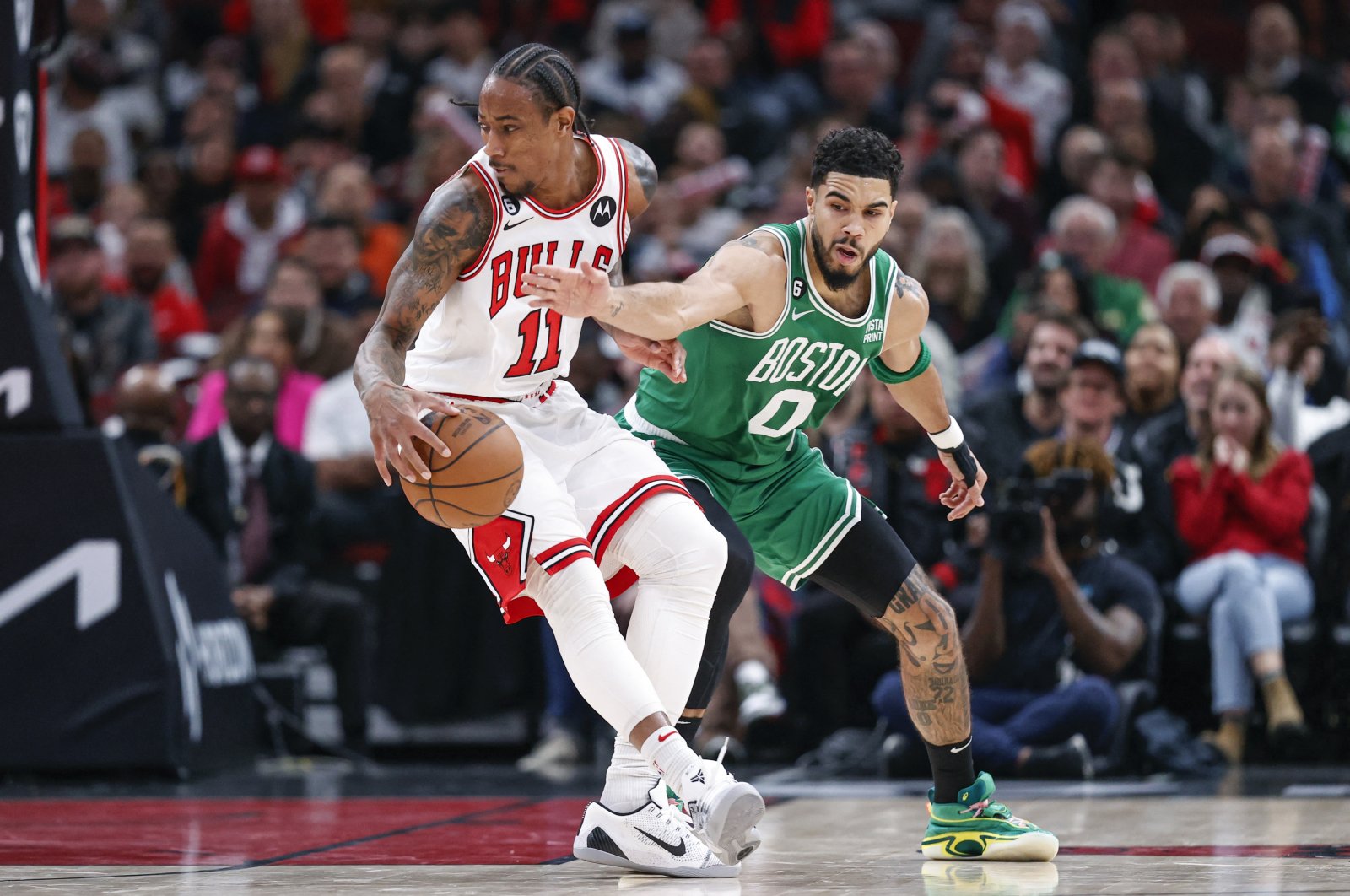 Chicago Bulls forward DeMar DeRozan (11) is defended by Boston Celtics forward Jayson Tatum (0) during the second half at United Center, Chicago, Illinois, U.S., Nov 21, 2022. (Reuters Photo)