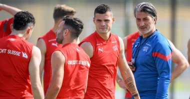 Switzerland&#039;s Granit Xhaka (2-R) and head coach Murat Yakin (R) attend a training session of the Swiss national football team in preparation for the FIFA World Cup Qatar 2022, Doha, Qatar, Nov. 20 2022. (EPA Photo)