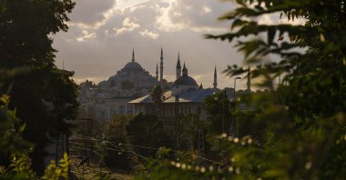 View of the dark sky and clouds over houses in the city of Istanbul, Türkiye. (Shutterstock Photo)