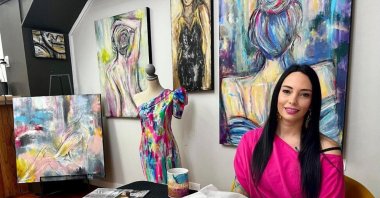 Louisiana artist Mandy Poche poses for a photo at her gallery in Ponchatoula, Louisiana, U.S., Nov. 1, 2022. (AP Photo)