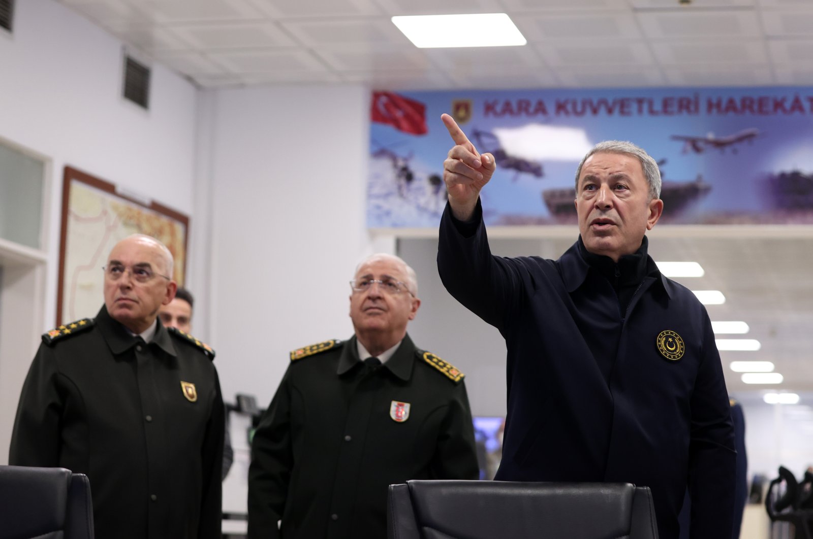 Defense Minister Hulusi Akar (R) is seen at the operations center of the Land Forces Command in the capital Ankara, Türkiye, Nov. 23, 2022. (AA Photo)