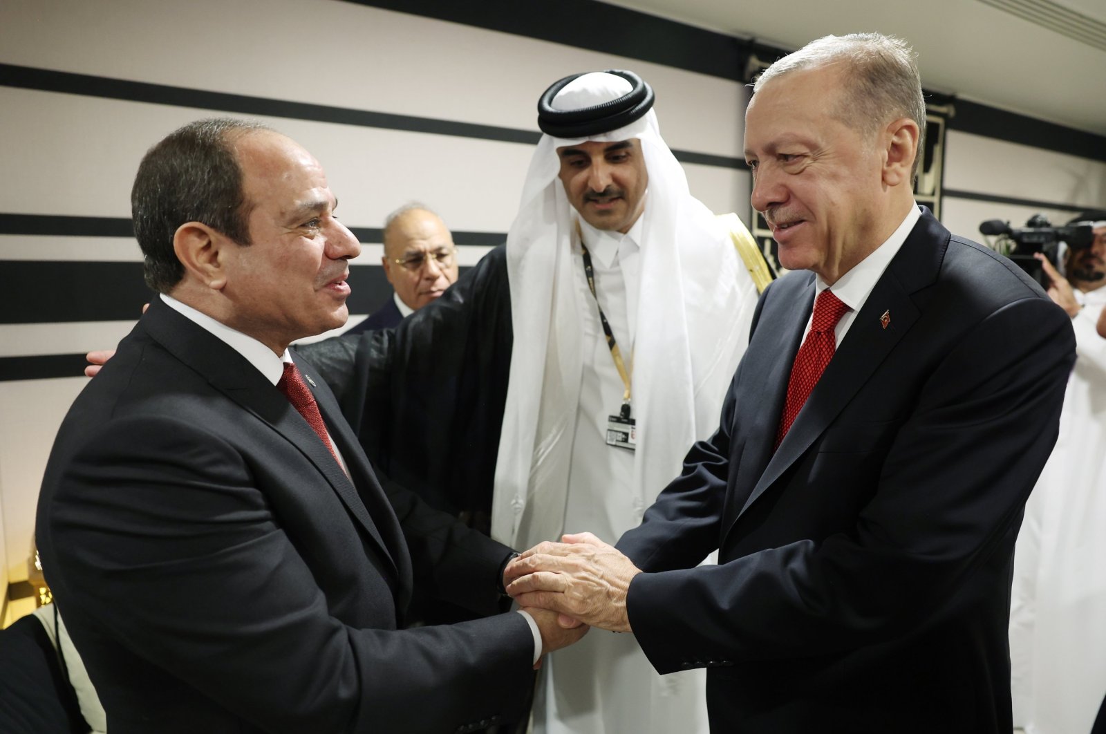 President Recep Tayyip Erdoğan shakes hands with his Egyptian counterpart Abdel-Fattah el-Sissi (L) during their meeting at the opening ceremony of the World Cup in Doha, Qatar, Nov. 20, 2022. (EPA Photo)