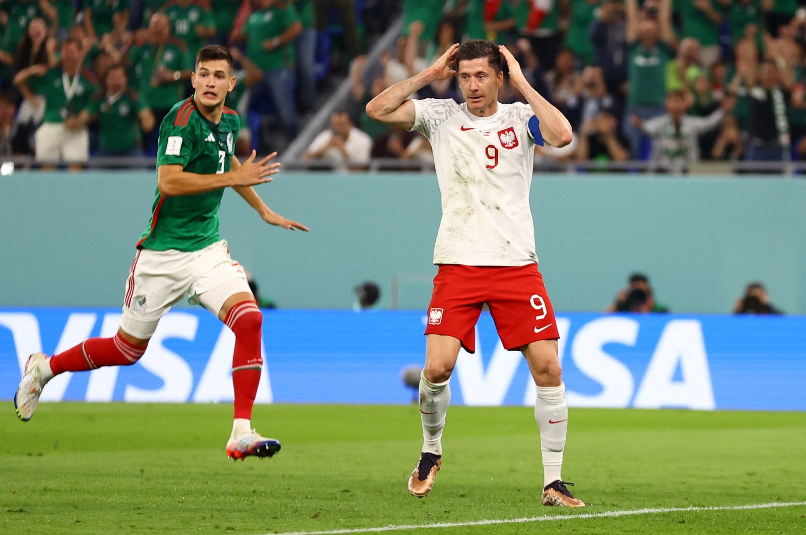 Poland&#039;s Robert Lewandowski reacts after having a penalty kick saved by Mexico&#039;s Guillermo Ochoa at Stadium 974, Doha, Qatar, Nov. 22, 2022. (Reuters Photo)