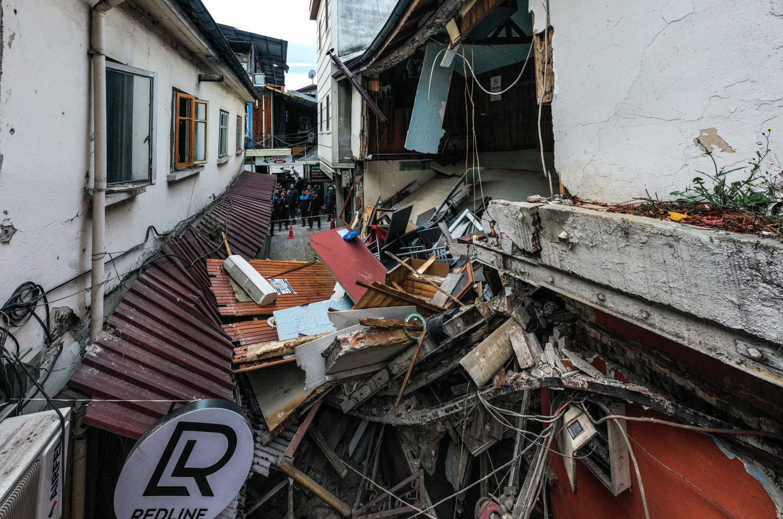 Pieces of damaged houses litter a narrow street, in Düzce, northern Türkiye, Nov. 23, 2022. (AA Photo)