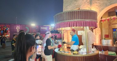 Turkish ice cream vendor Harun Ardağ sells Maraş ice cream to 2022 World Cup fans, Doha, Qatar, Nov. 23, 2022. (AA Photo)