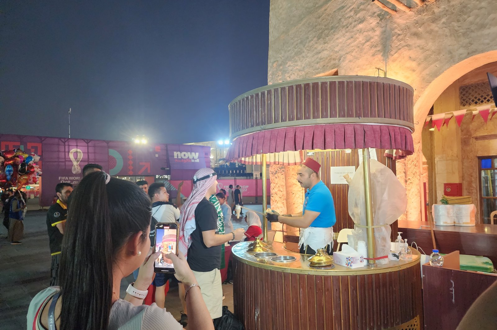 Turkish ice cream vendor Harun Ardağ sells Maraş ice cream to 2022 World Cup fans, Doha, Qatar, Nov. 23, 2022. (AA Photo)