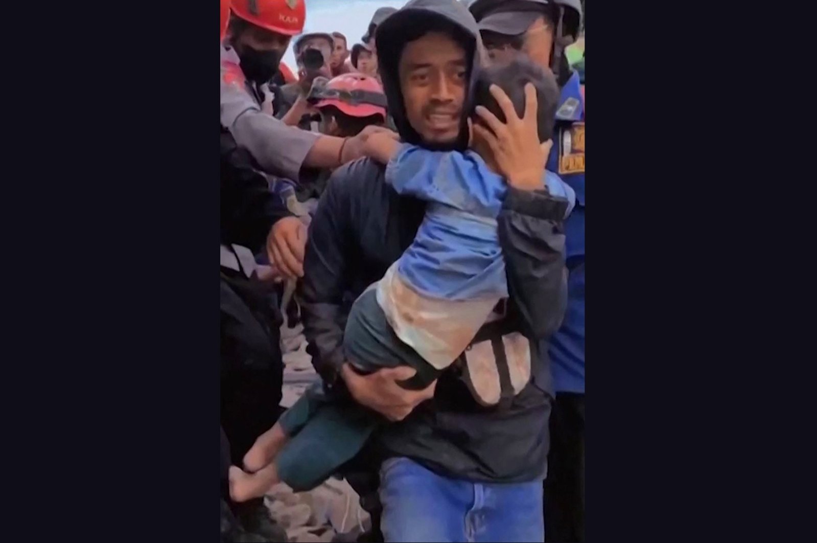 This screen grab shows a 6-year-old boy being pulled out of the rubble in Cianjur, Indonesia, Nov. 23, 2022. (AFP Photo)