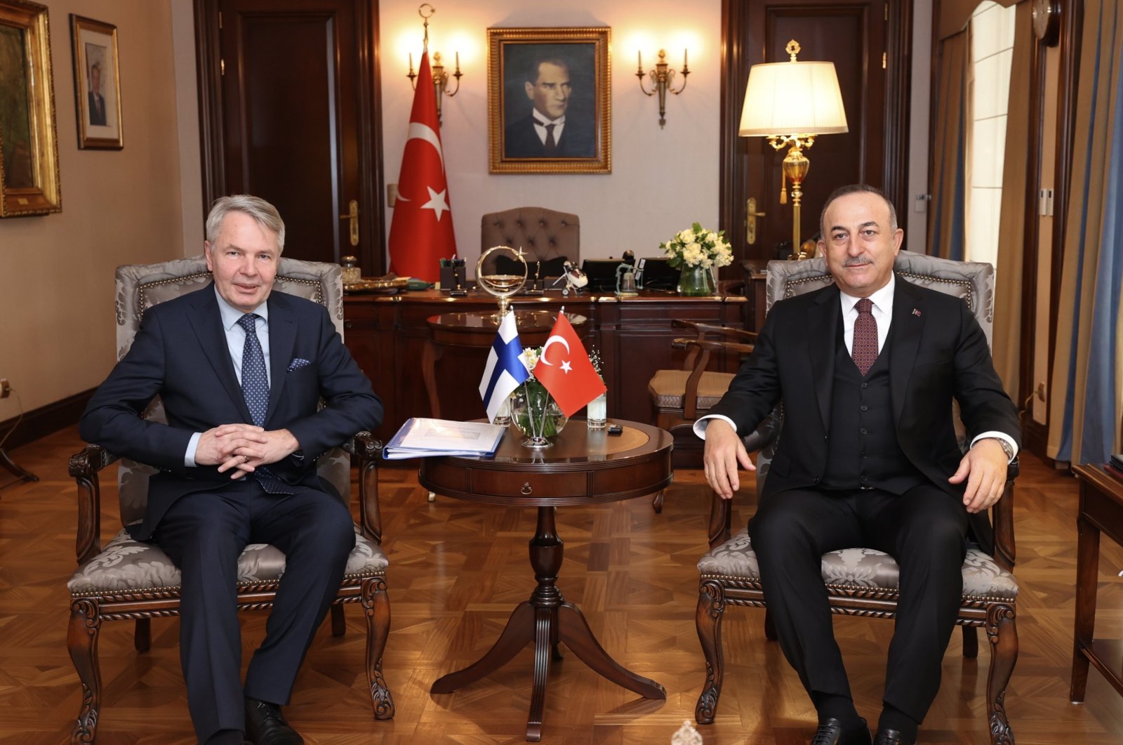 Foreign Minister Mevlüt Çavuşoğlu (R) and Finnish Foreign Minister Pekka Haavisto pose for a photo during their meeting in the capital Ankara, Türkiye, Feb. 8, 2022. (EPA Photo)