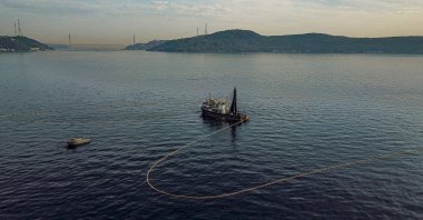 A fishing boat lays its nets in the Marmara Sea off the coast of Istanbul, Türkiye, Nov. 6, 2022. (AFP Photo)