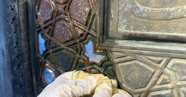 An expert works on the restoration of the 400-year-old gates of the Blue Mosque, in Istanbul, Türkiye, Nov. 24, 2022. (AA Photo)