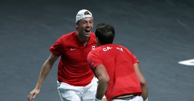 Canada&#039;s Denis Shapovalov and Vasek Pospisil celebrate after winning the men&#039;s double quarterfinal tennis match between Germany and Canada of the Davis Cup tennis tournament at the Martin Carpena sports hall, Malaga, Spain, Nov. 24, 2022. (AFP Photo)