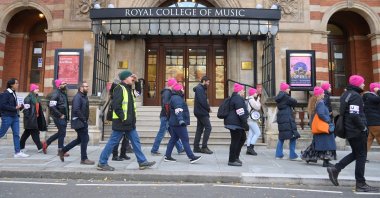 Teaching staff, together with other workers and supporters from Imperial College, march past the Royal College of Music as they strike, in London, Britain, Nov. 24, 2022. (Reuters Photo)