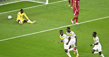 Senegal's forward Bamba Dieng (L) celebrates scoring his team's third goal during the Qatar 2022 World Cup Group A football match between Qatar and Senegal, at the Al-Thumama Stadium, in Doha, Qatar, Nov. 25, 2022. (AFP Photo)