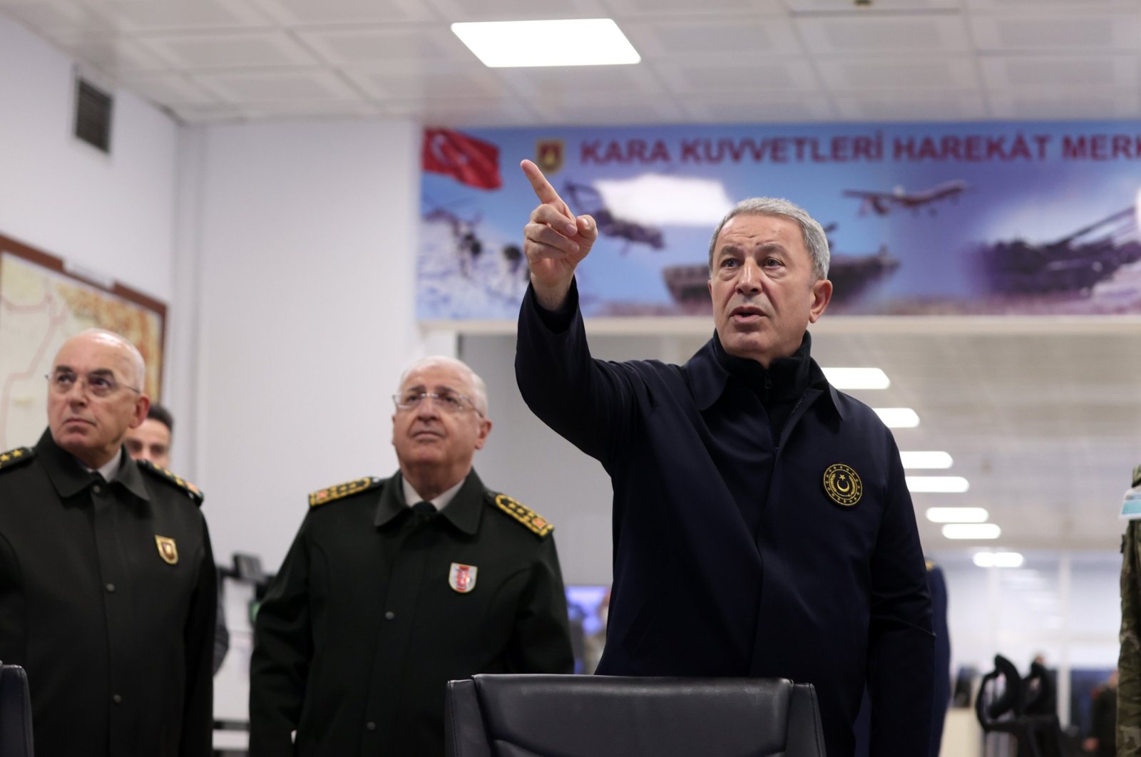 Defense Minister Hulusi Akar (R) is seen at the operations center of the Land Forces Command in the capital Ankara, Türkiye, Nov. 23, 2022. (AA Photo)