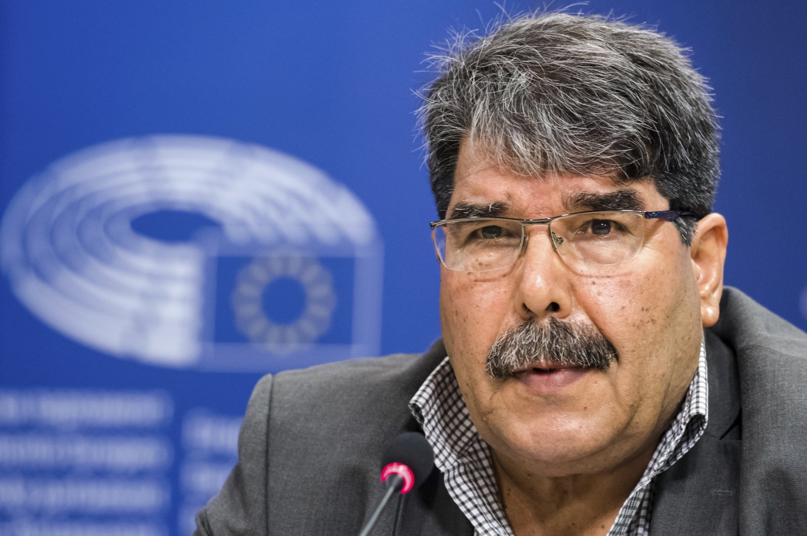 Senior PKK figure Salih Muslim addresses journalists at the European Parliament in Brussels, Belgium, Sept. 1, 2016. (AP Photo)