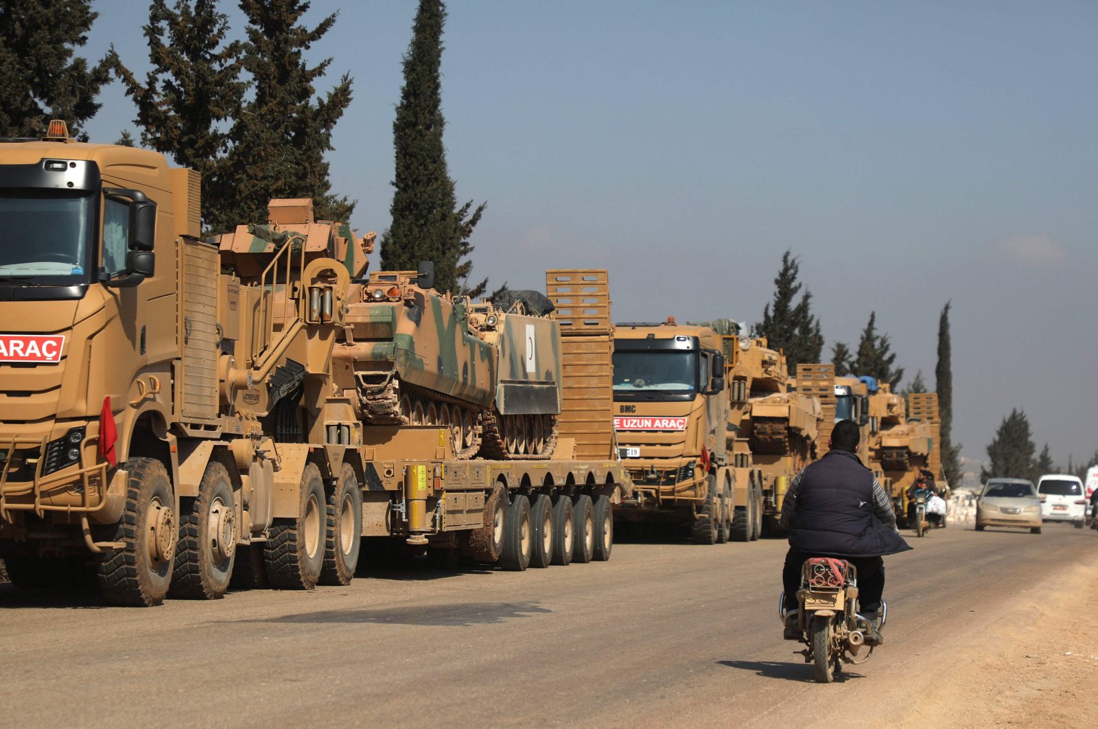 In this file photo, a convoy of Turkish military vehicles is pictured near the town of Hazano in the northern countryside of Syria&#039;s Idlib province, March 3, 2020. (AFP Photo)