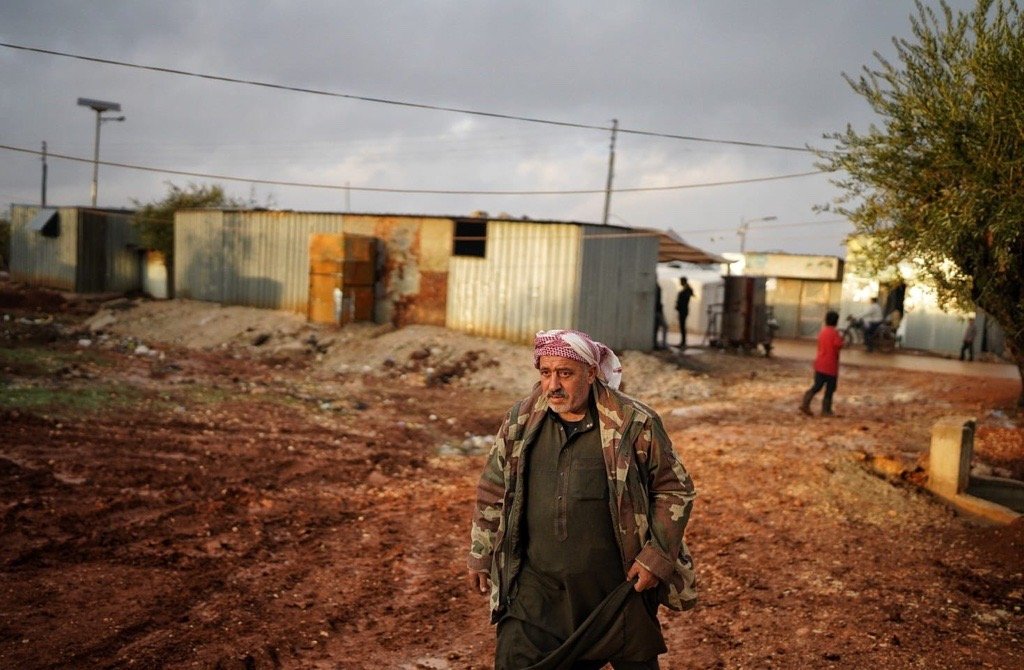 A man walks in PKK/YPG-occupied Tal Rifaat, in northern Syria, Nov. 26, 2022. (Photo by Uğur Yıldırım)