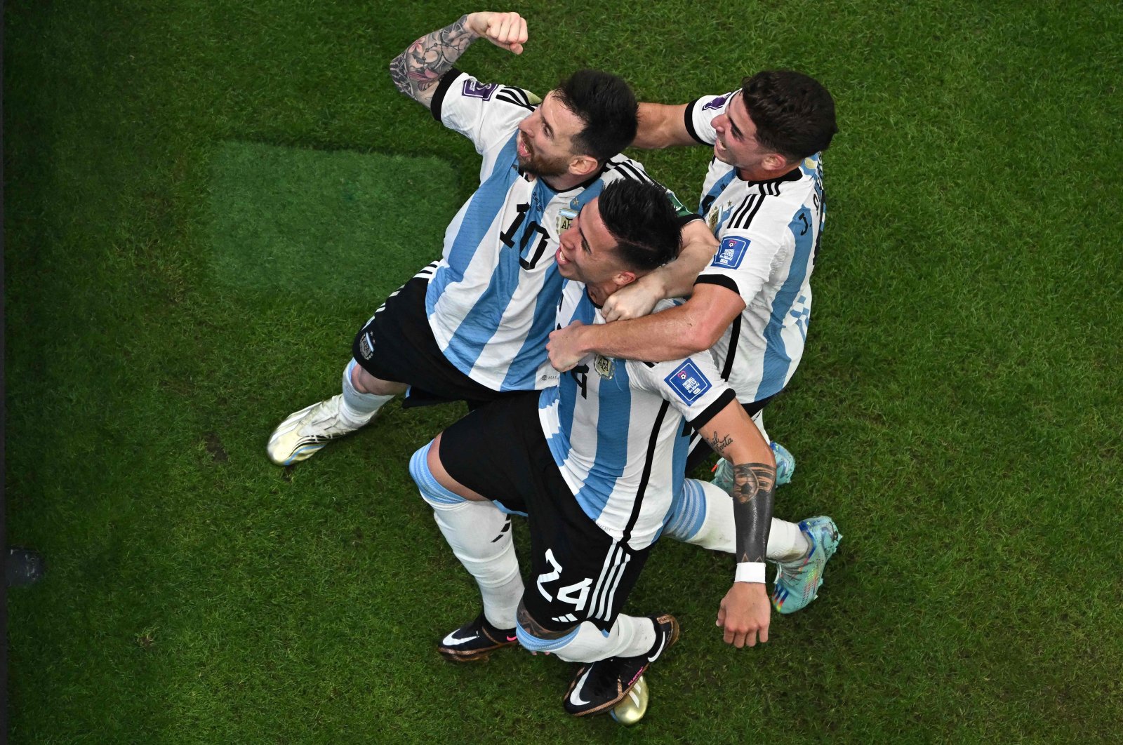 Argentina&#039;s Enzo Fernandez (C) and Lionel Messi (L) celebrate during the Qatar 2022 World Cup Group C football match between Argentina and Mexico, at the Lusail Stadium, in Lusail, Qatar, Nov. 26, 2022. (AFP Photo)