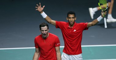 Canada Felix Auger-Aliassime (R) and Vasek Pospisil celebrate after winning the men&#039;s double semi-final tennis of the Davis Cup tennis tournament match between Italy and Canada at the Martin Carpena sportshall, Malaga, Spain, Nov. 26, 2022. (AFP Photo)
