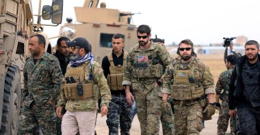 PKK/YPG terrorists and U.S. troops are seen together during a joint patrol near the Turkish border in Hassakeh, northeastern Syria, Nov. 4, 2018. (Reuters File Photo)