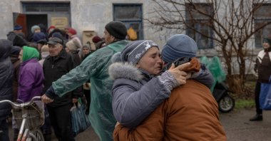 People react as they meet after a long time in Kherson, Ukraine, Nov. 26, 2022. (EPA Photo)