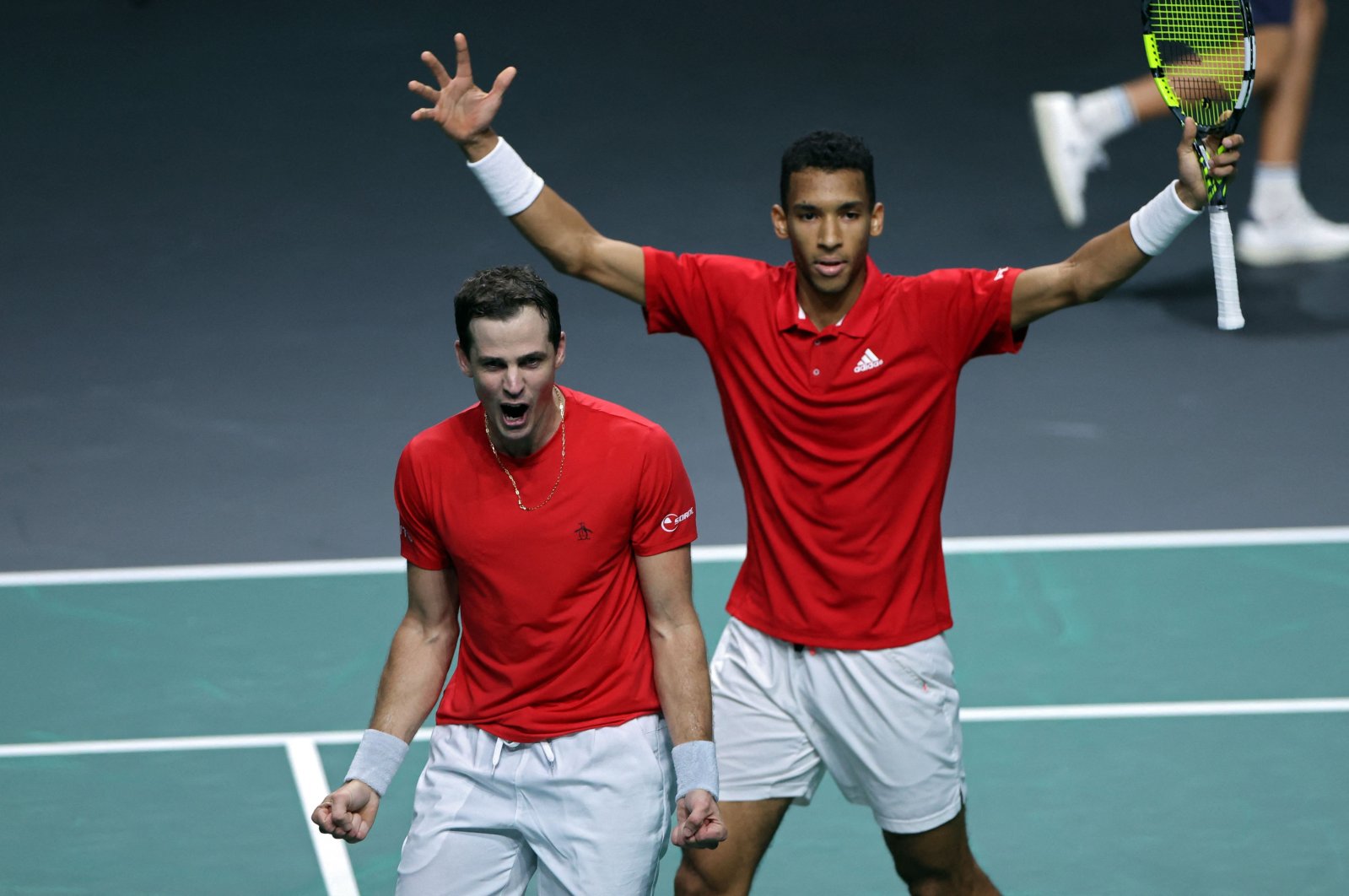 Canada Felix Auger-Aliassime (R) and Vasek Pospisil celebrate after winning the men&#039;s double semi-final tennis of the Davis Cup tennis tournament match between Italy and Canada at the Martin Carpena sportshall, Malaga, Spain, Nov. 26, 2022. (AFP Photo)