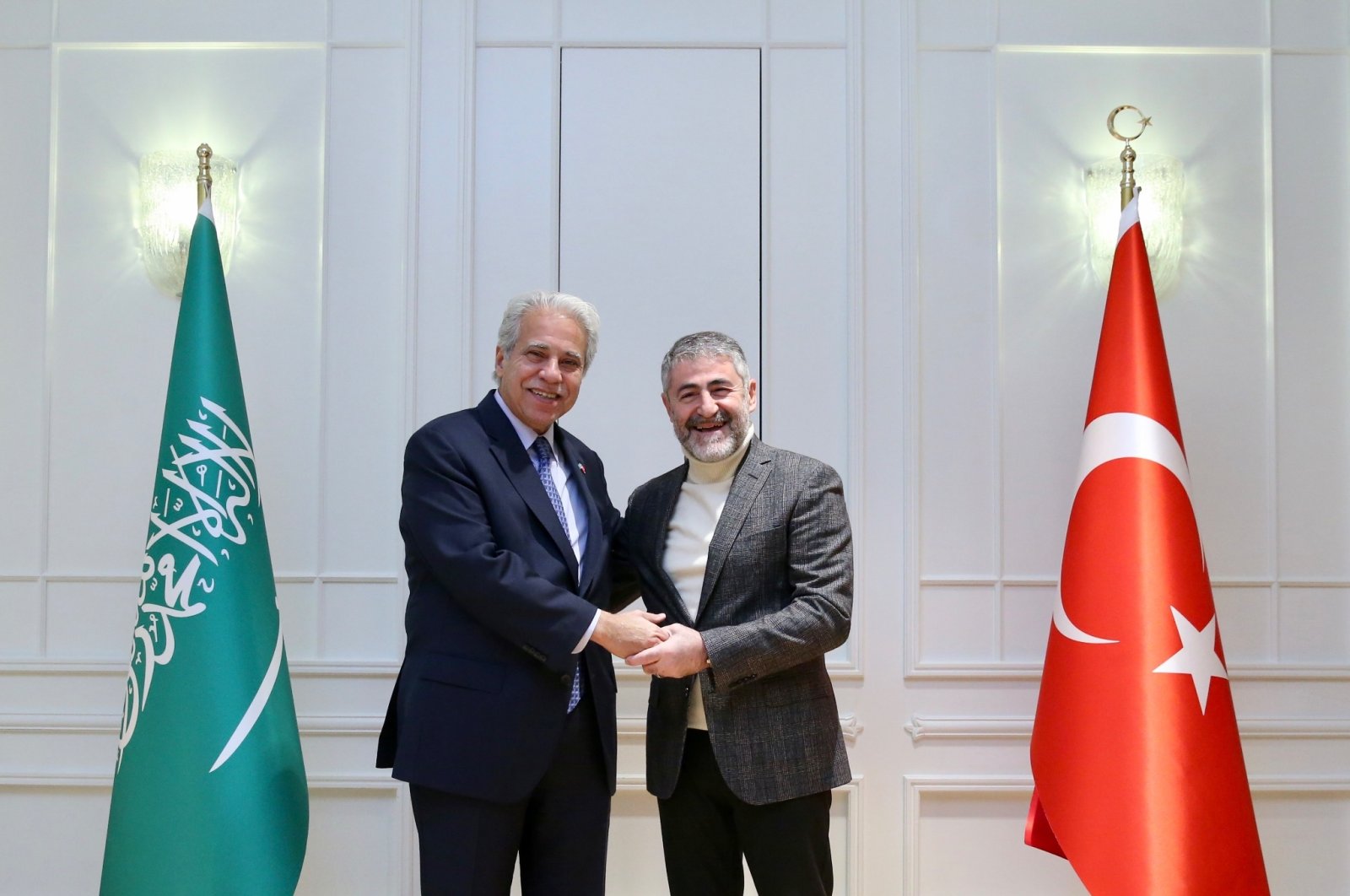 Türkiye’s Treasury and Finance Minister Nureddin Nebati (R) shakes hands with Saudi Arabian Trade Minister Majid bin Abdullah Al Qasabi (L), Istanbul, Türkiye, Nov. 27, 2022. (Photo: @NureddinNebati)