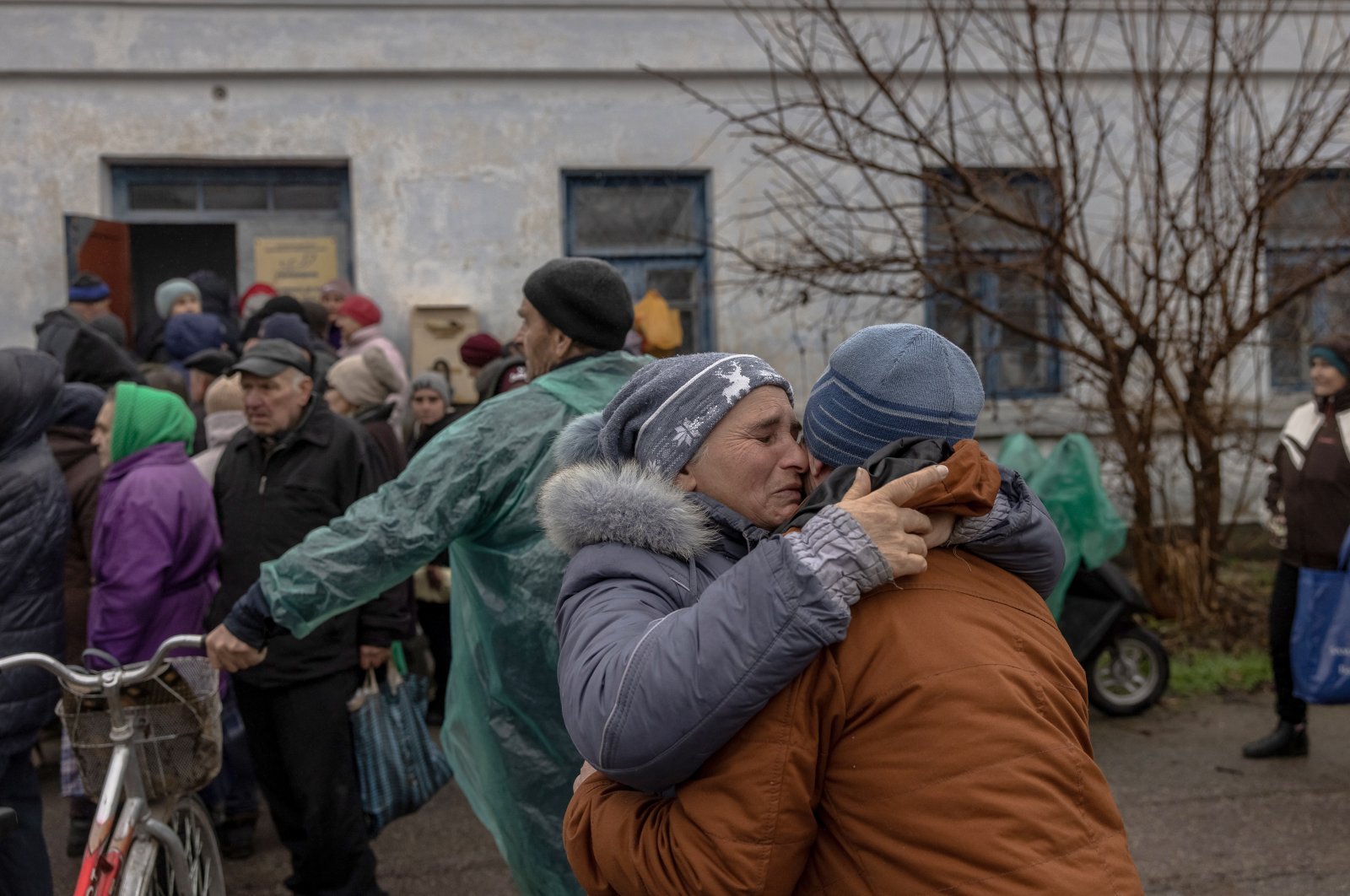 People react as they meet after a long time in Kherson, Ukraine, Nov. 26, 2022. (EPA Photo)