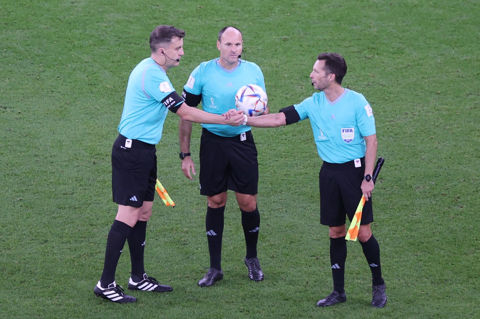 Spanish referee Antonio Mateu Lahoz (C) and his assistants during a FIFA World Cup match, Doha, Qatar, Nov. 25, 2022. (EPA Photo)