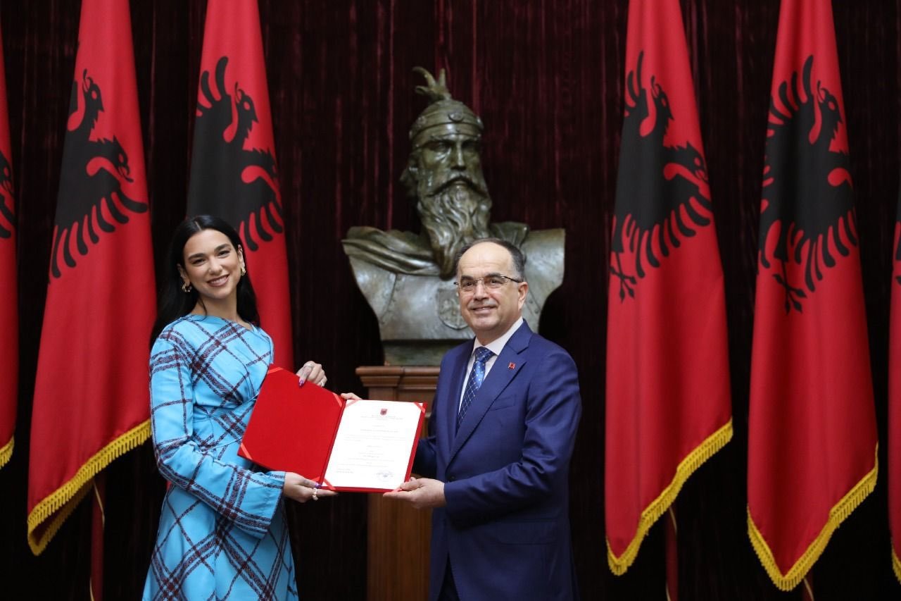 President Bajram Begaj presents the document of Albanian citizenship to singer Dua Lipa, Tirana, Albania, Nov. 27, 2022. (From Twitter / @BajramBegajAL)