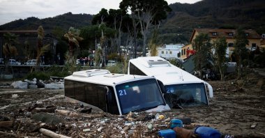 Damaged buses lie among debris following a landslide on the Italian holiday island of Ischia, Italy, Nov. 27, 2022. (Reuters Photo)