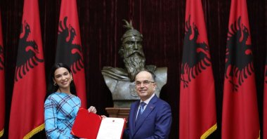 President Bajram Begaj presents the document of Albanian citizenship to singer Dua Lipa, Tirana, Albania, Nov. 27, 2022. (From Twitter / @BajramBegajAL)